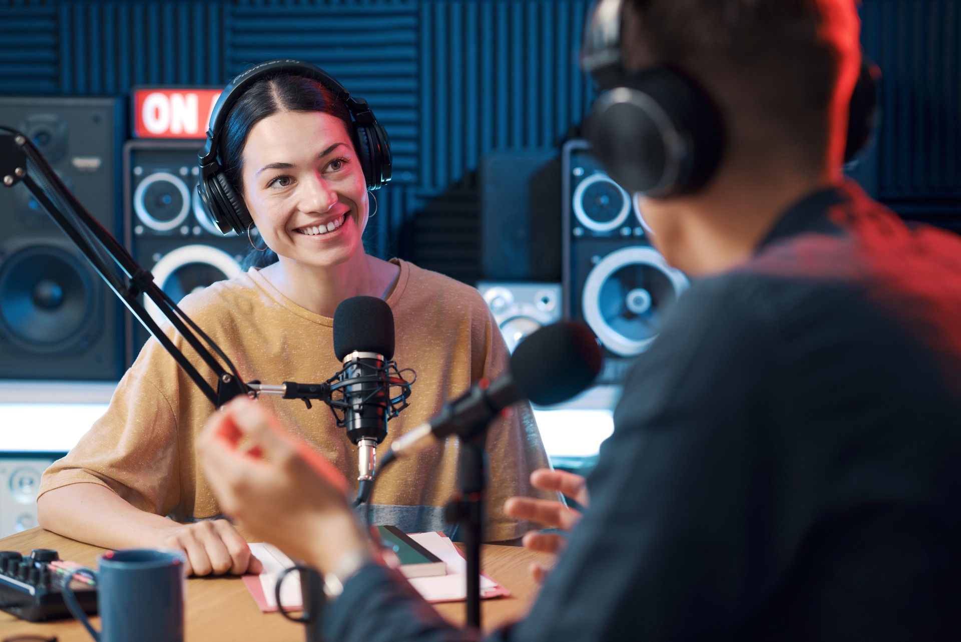 Radio host interviewing a guest in the studio